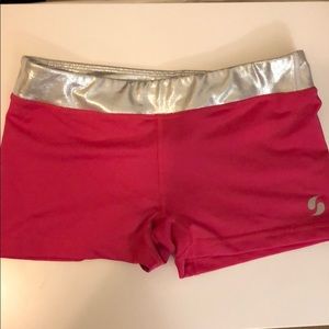 Pink and silver gymnastics shorts